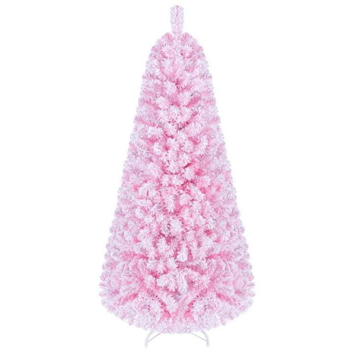 Lite rosa snødekt juletre med lys