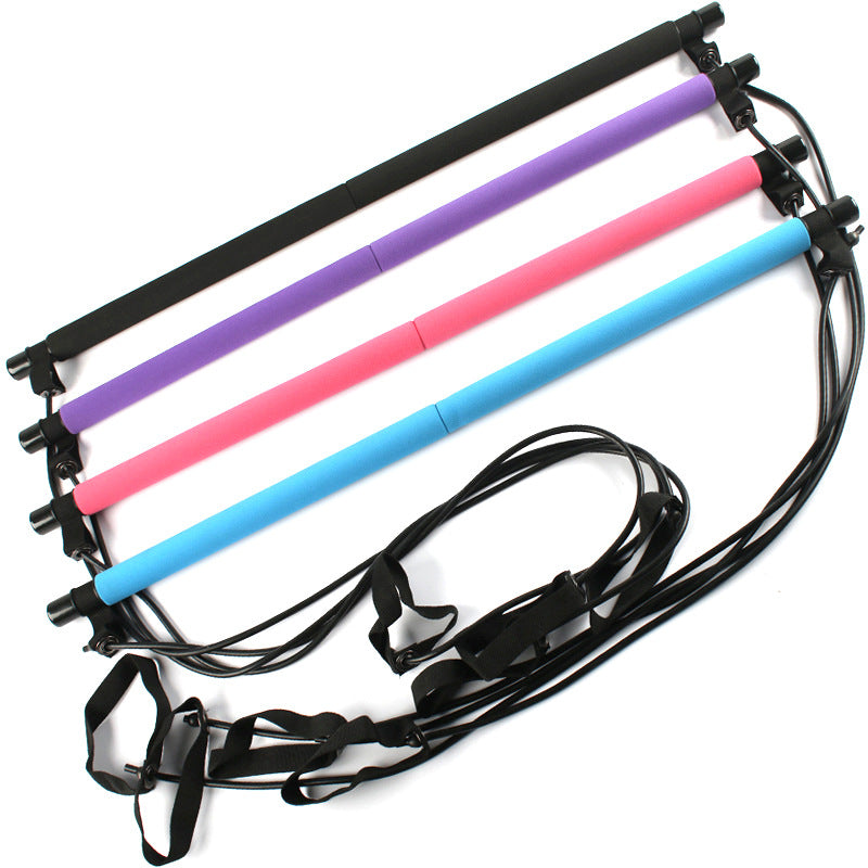 Pilatesstang med strikk og fotstropper