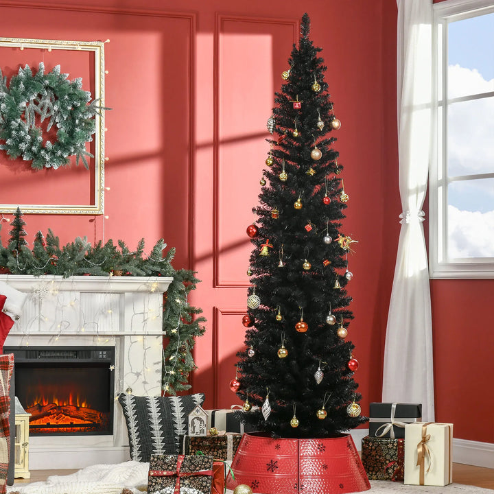 Slankt svart kunstig juletre i stue