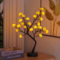 Rosetrelampe med lysende roser