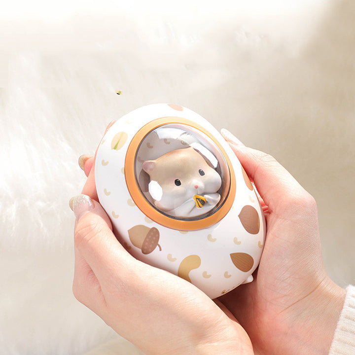 Håndvarmer og powerbank med hamster, 5000 mAh og fire nivåer