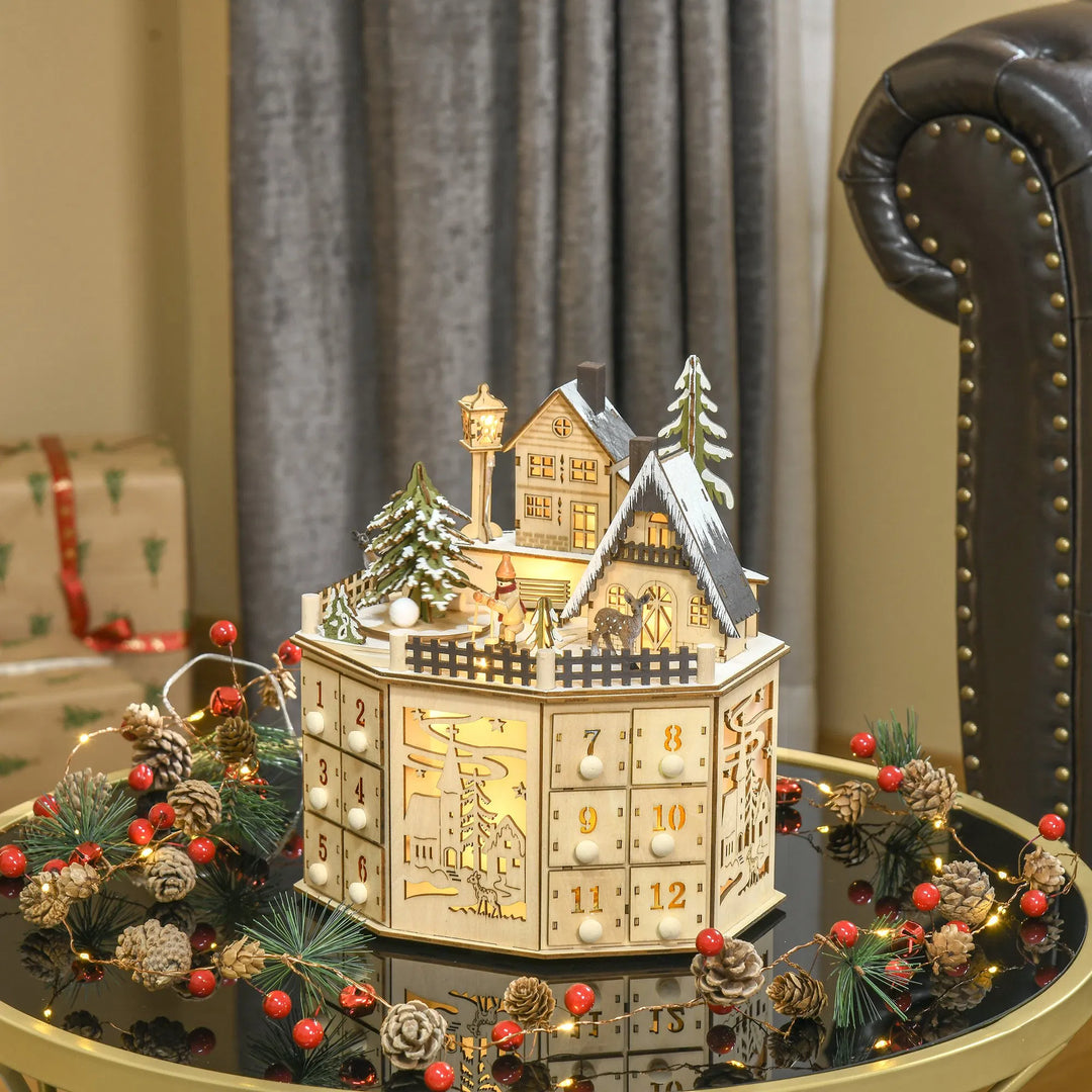 Adventskalender i tre som julelandsby med lys