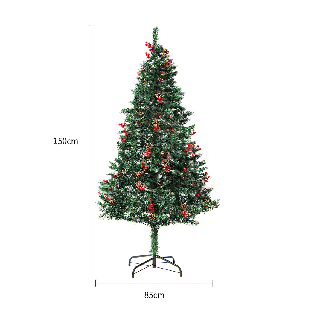 Kunstig juletre med varmhvite lys i stue