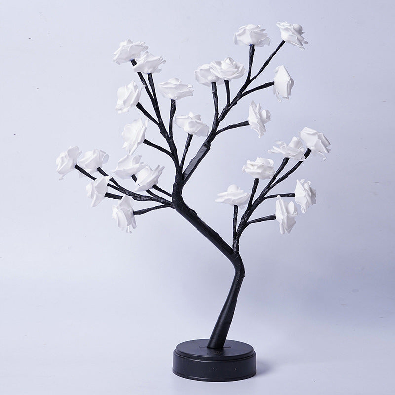 Rosetrelampe med lysende roser