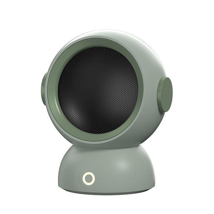 Rund varmevifte i astronautdesign på bord