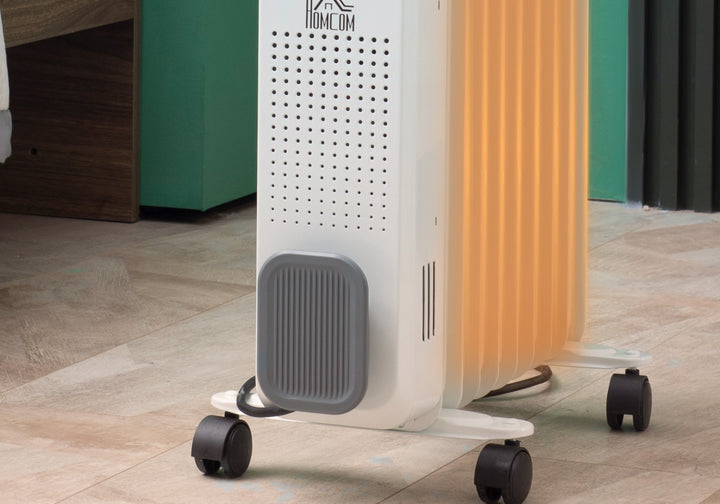 Hvit oljefylt radiator med ni ribber
